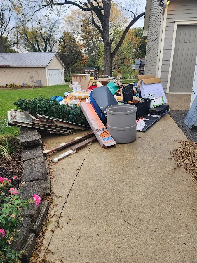 Dumpster being loaded with debris for 3 Yard Dumpster Rental in Eldorado at Santa Fe